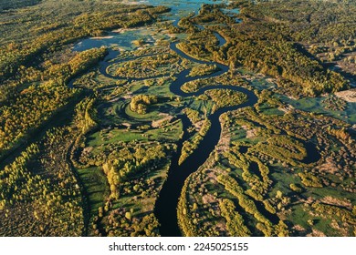Aerial View Green Forest Woods And River Landscape In Sunny Spring Summer Day. Top View Of Nature, Bird's Eye View. Trees Standing In Water During Spring Flood floodwaters. woods in Water deluge - Shutterstock ID 2245025155