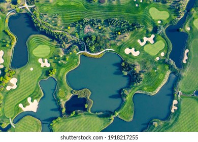Aerial View Of Green Grass And Trees On A Golf Field.