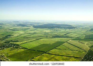 Aerial view of a green rural area under blue sky. Moldova