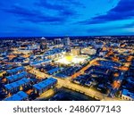 An aerial view of Greensboro, NC city lights at dusk