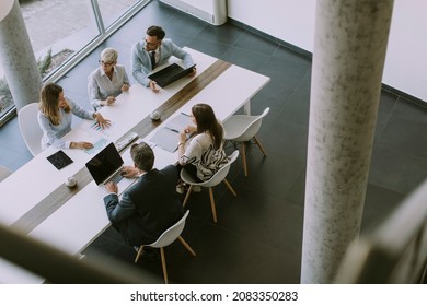 Aerial View At Group Of Business People Working Together And Preparing New Project On A Meeting In The Office