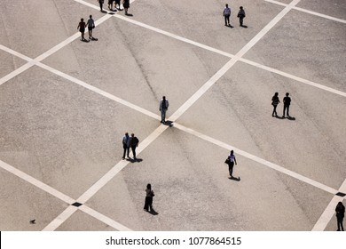 Aerial View Of A Group Of People Walking In A Square In The City Of Lisbon In Portugal. April 2018