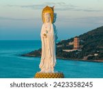 Aerial view of Guanyin statue at seaside in nanshan temple, hainan island , China. Words mean mercy and blessing.