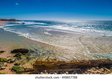 Aerial view of Guincho beach (Praia Grande do Guincho) in Portugal during sunny day and clear sky