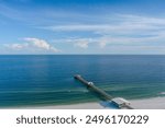 Aerial view of the Gulf State Pier and the beach at Gulf Shores, Alabama in July