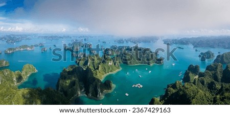 Aerial view of Ha Long Bay in beautiful sunny day, emerald green water. Asia nature background