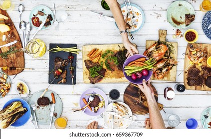 Aerial View Of Hands Sharing Food Together