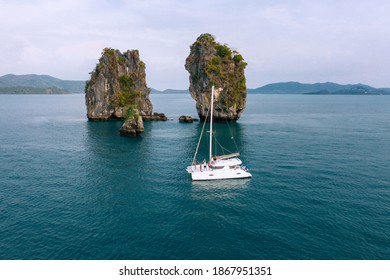 Aerial View Of Happy Millenial Friends Resting On Sailing Yacht On Sea Ocean Trip - Rich Guys And Girls Having Fun Together In Exclusive Boat Party Day - Luxury Vacation Concept