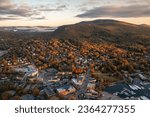 Aerial view of harbor town Camden, Maine in New England during morning sunrise with autumn Fall Foliage colors 