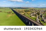 An aerial view from Harringworth of the spectacular Harringworth railway viaduct crossing the Welland Valley on a sunny day in the UK