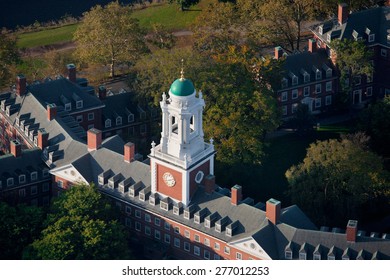 AERIAL VIEW of Harvard Campus featuring Eliot House Clock Tower along Charles River, Cambridge, Boston, MA 