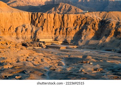 Aerial view of Hatshepsut Temple at sunrise in Valley of the Kings and red cliffs western bank of Nile river- Luxor- Egypt - Shutterstock ID 2223692515