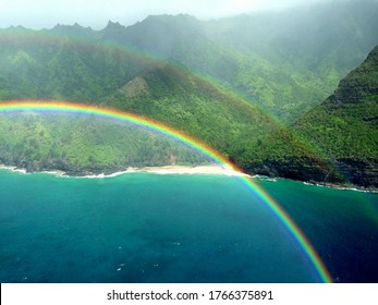 Aerial View Of Hawaiian Island With Mountains And Rainbow￼