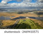 Aerial view of Hawaiian island of Oahu  with Hawaii Prince Golf Club, solar engery fields and the towns of Waipahu and Pearl City in the background