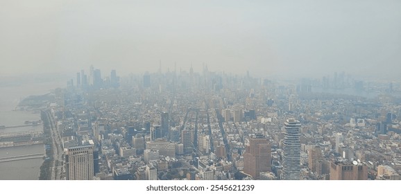 Aerial view of a hazy city skyline, with buildings partially obscured by smog, highlighting urban density and environmental concerns. - Powered by Shutterstock