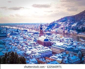 Aerial View Of Heidelberg Town And Neckar River In Winter With Snow From The Castle In The Baden-Wurttemberg Region Of Southwest Black Forest In Germany During Winter Christmas Time