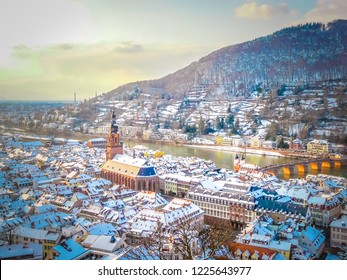 Aerial View Of Heidelberg Town And Neckar River In Winter With Snow From The Castle In The Baden-Wurttemberg Region Of Southwest Black Forest In Germany During Winter Christmas Time