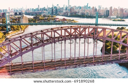 Aerial view of the Hell Gate Bridge over the East River in New York City