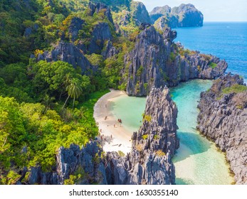 Aerial view of Hidden beach in Matinloc Island, El Nido, Palawan, Philippines - Tour C route - Paradise lagoon and beach in tropical scenery