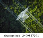 Aerial view of high voltage electric tower in forest