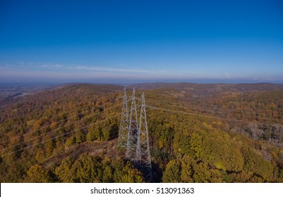 Aerial view. High voltage metal post. High-voltage transmission tower.