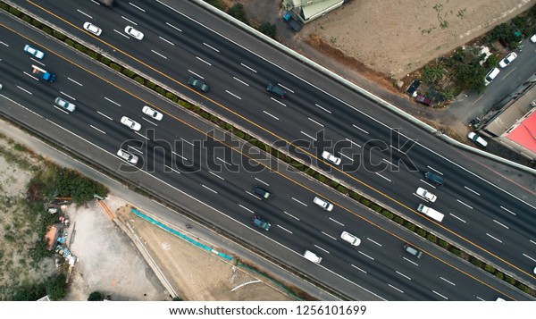 Aerial\
view high way. Asia. Drone photo. City\
traffic.