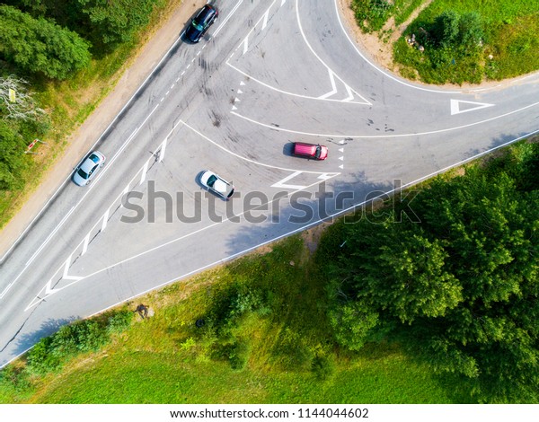 Aerial view of highway
with car. Aerial view of a country road with moving car. Car
passing by. Aerial road. Aerial view flying. Captured from above
with a drone. Soft
lighting