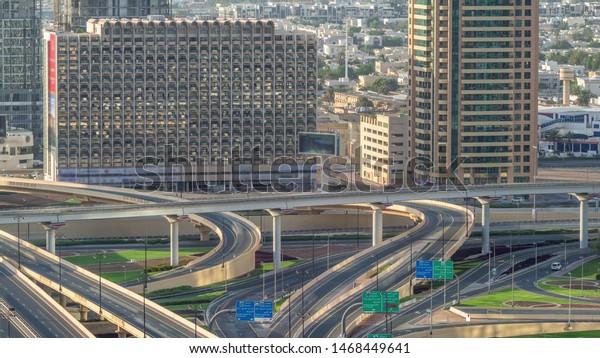 Aerial view of highway interchange\
in Dubai downtown timelapse. Cityscapes traffic bridge, logistics.\
Roads and lanes Crossroads, Dubai, United Arab\
Emirates