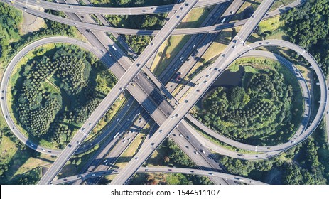 Aerial View Of Highway Interchange - Transport Concept Image, Busy Roads Of Morning Golden Hour, Birds Eye Top View Use The Drone In Taoyuan International Airport System Interchange, Taoyuan, Taiwan.