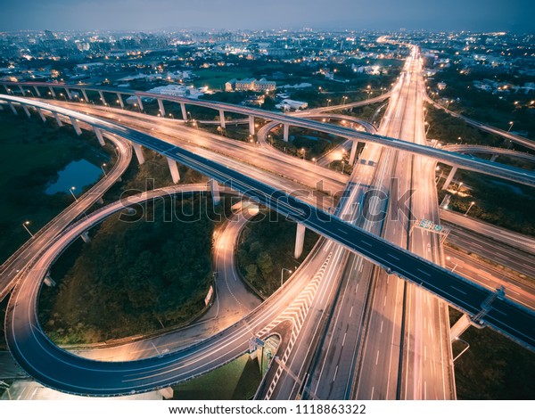 Aerial View of Highway\
Interchange - Transport concept image, long exposure birds eye view\
use the drone, shot in Pingzhen Interchange System, Taoyuan,\
Taiwan.