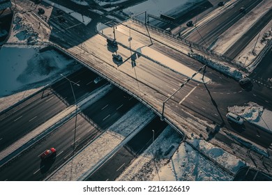 Aerial view of the highway and intersection in the city on a winter day.