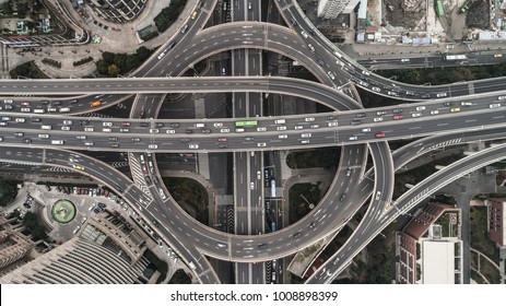 Aerial view of highway and overpass in city on a cloudy day