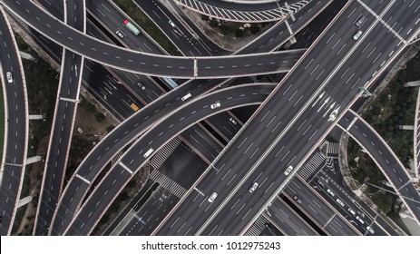 Aerial view of highway and overpass in city on a cloudy day