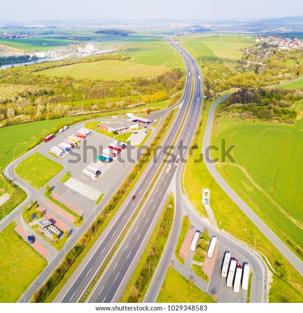 Aerial view of highway rest area with
restaurant and large car park for cars and trucks. D5 motorway in
west Bohemia, Czech republic, European union. Top view of highway
infrastructure.