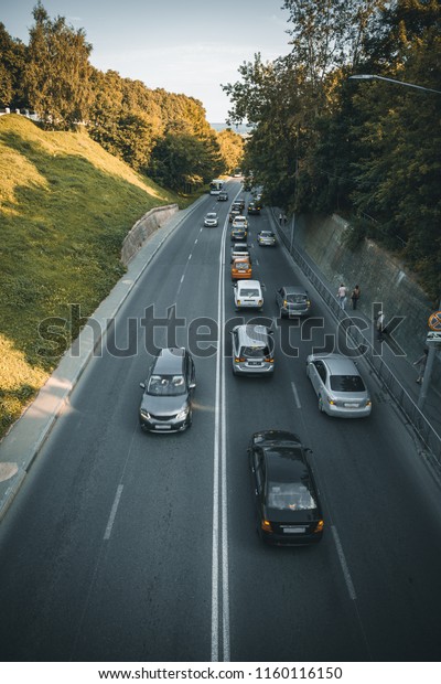 Aerial view at highway\
street road with city traffic cars, urban transportation concept,\
toned