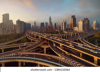 Aerial View Of Highways In Shanghai Downtown, China. Financial District And Business Centers In Smart City In Asia. Top View Of Skyscraper And High-rise Buildings At Sunset.