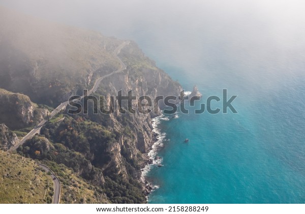 Aerial view from a hiking trail on the coastal
driving road of the beautiful scenic Amalfi Coast, Campania, Italy,
Europe. Riviera coastline at Mediterranean sea. Panoramic curvy
road near Positano