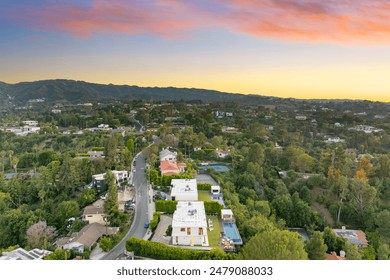 An Aerial view of a hilltop house overlooking a residential area with luxury homes - Powered by Shutterstock