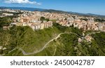 Aerial view of the historic center of Catanzaro and the famous access bridge to the city. It is the capital of Calabria, southern Italy. In the background is the Ionian Sea.