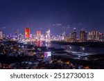 Aerial view of Ho Chi Minh City skyline and skyscrapers on Saigon river, center of heart business at downtown. Far away is Landmark 81 skyscraper. Night view. Financial and business concept