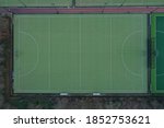 Aerial view of a hockey field with artificial green colored grass