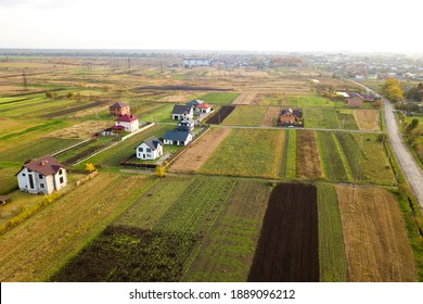 Aerial view of home roofs in residential rural neighborhood area.