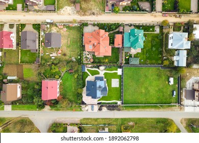 Aerial View Of Home Roofs In Residential Rural Neighborhood Area.