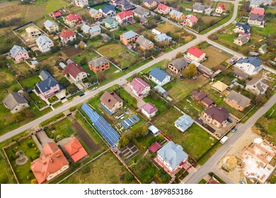 Aerial View Of Home Roofs In Residential Rural Neighborhood Area.