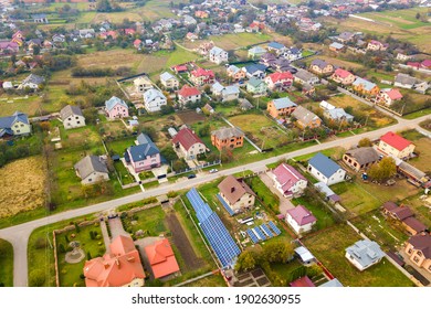 Aerial View Of Home Roofs In Residential Rural Neighborhood Area.