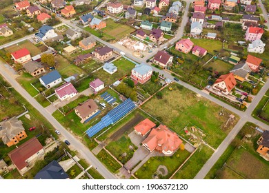 Aerial view of home roofs in residential rural neighborhood area.
