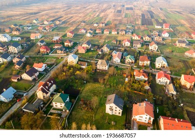 Aerial View Of Home Roofs In Residential Rural Neighborhood Area.