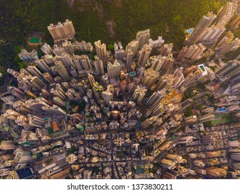 Aerial View Of Hong Kong Downtown, China. Financial District And Business Centers In Smart City In Asia. Top View Of Skyscraper And High-rise Buildings At Sunset. Top View