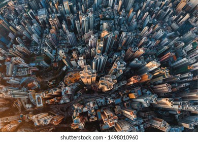 Aerial View Of Hong Kong Downtown. Financial District And Business Centers In Smart Urban City In Asia. Top View Of Skyscraper And High-rise Buildings At Sunset.