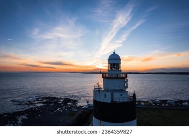 Aerial view of Hook Lighthouse is a building on Hook Head at the tip of the Hook Peninsula in County Wexford, Ireland. - Powered by Shutterstock